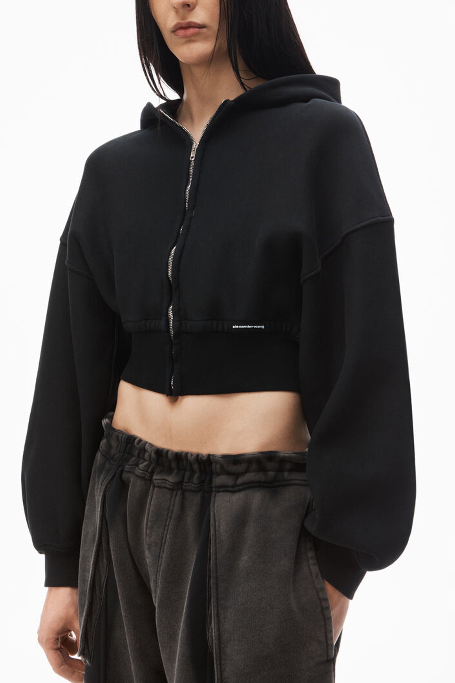 The Alexander Wang Cropped Zip Hoodie With Branded Seam Label in Faded Black available at The New Trend Australia