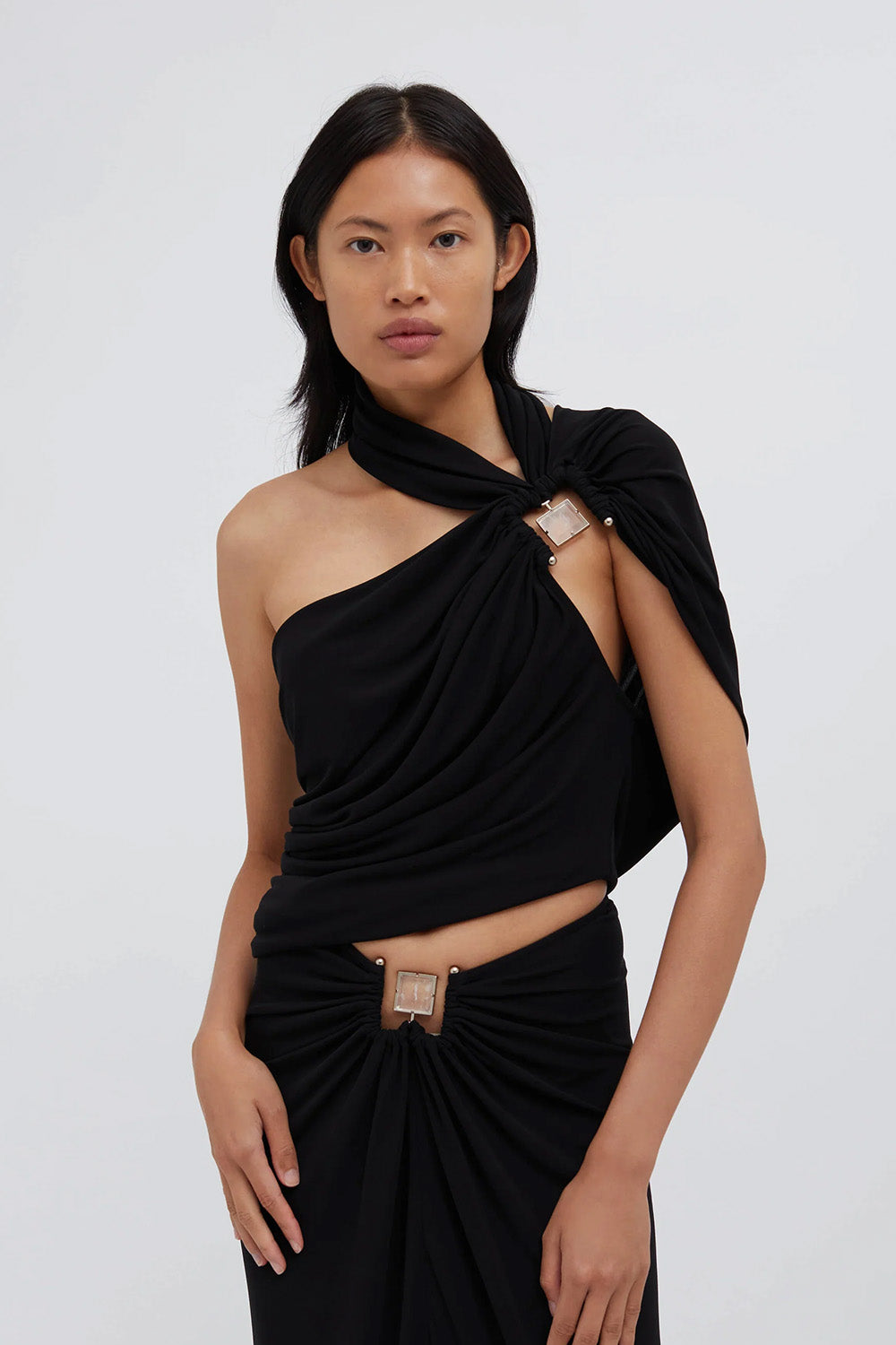 The Christopher Esber Bezel Quartz Halter Top in black is available at The New Trend