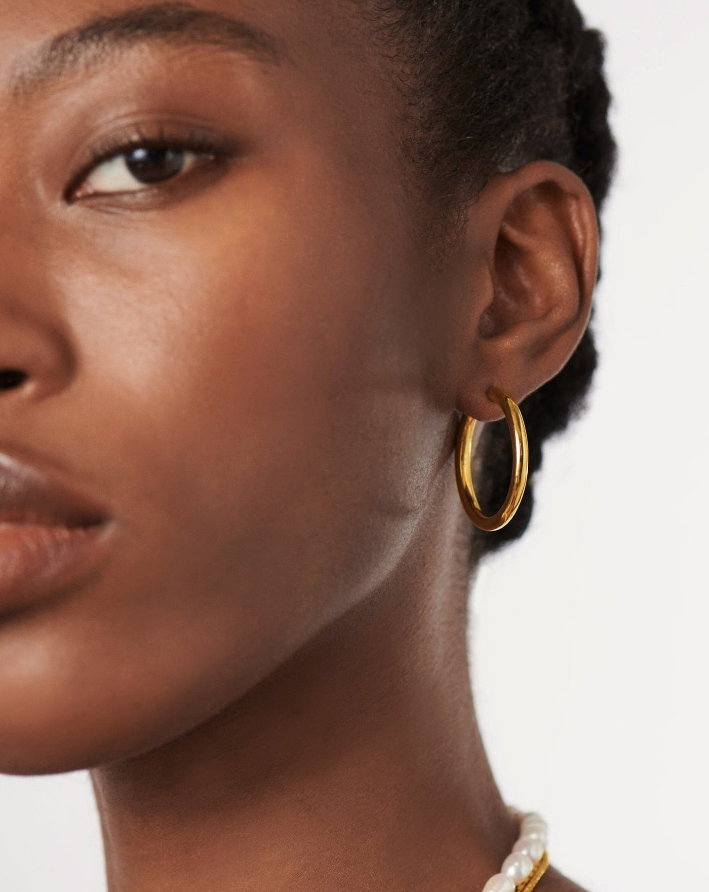 The Missoma Classic Tunnel Large Hoop Earrings in Gold available at The New Trend Australia