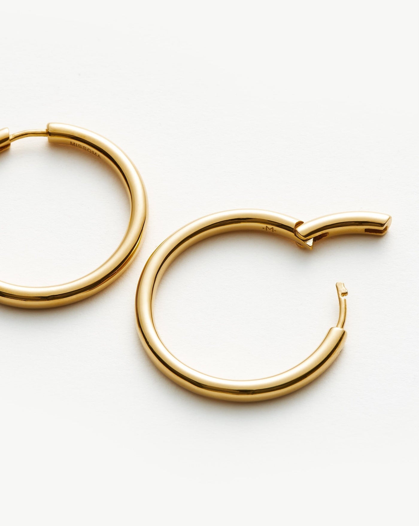 The Missoma Classic Tunnel Large Hoop Earrings in Gold available at The New Trend Australia