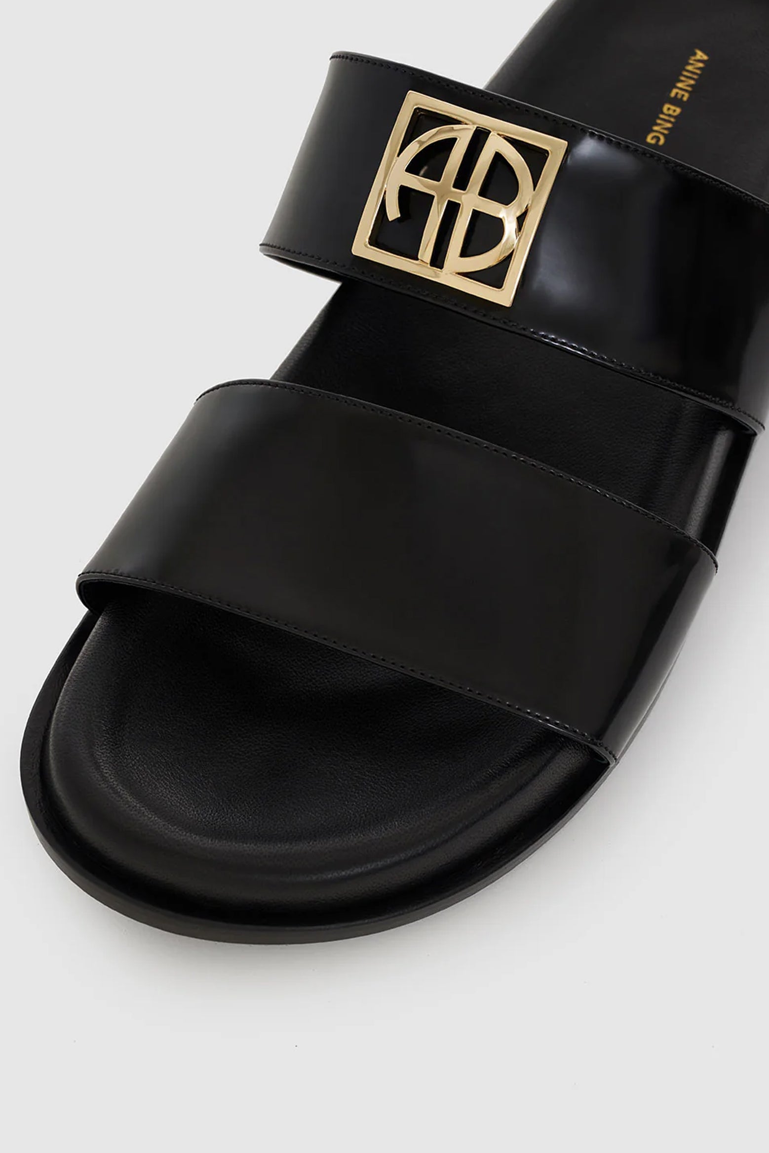 The Anine Bing Parker Slides Monogram in Black available at The New Trend Australia