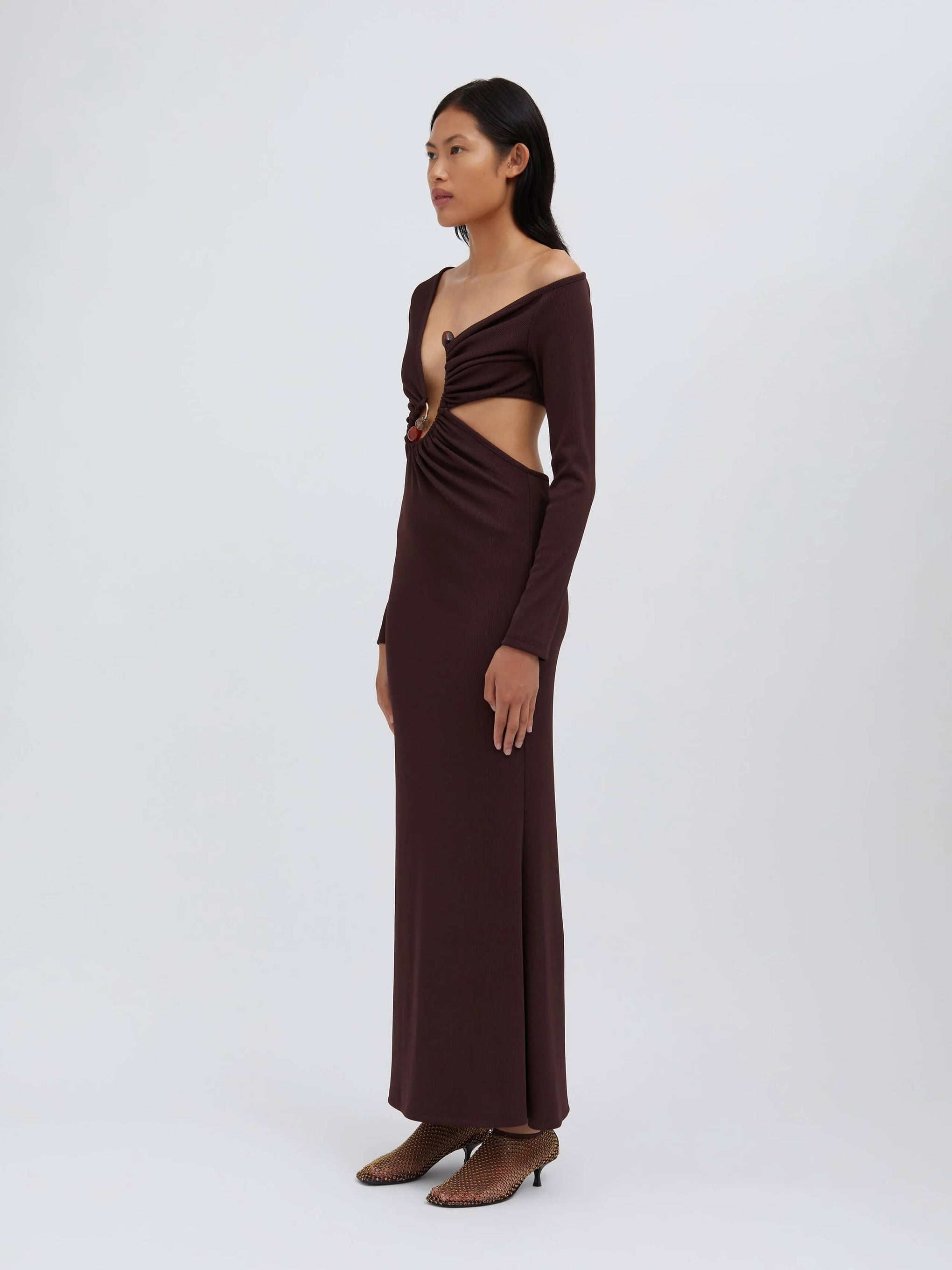 The Christopher Esber Spiral Crystal Dress in mahogany is available at The New Trend