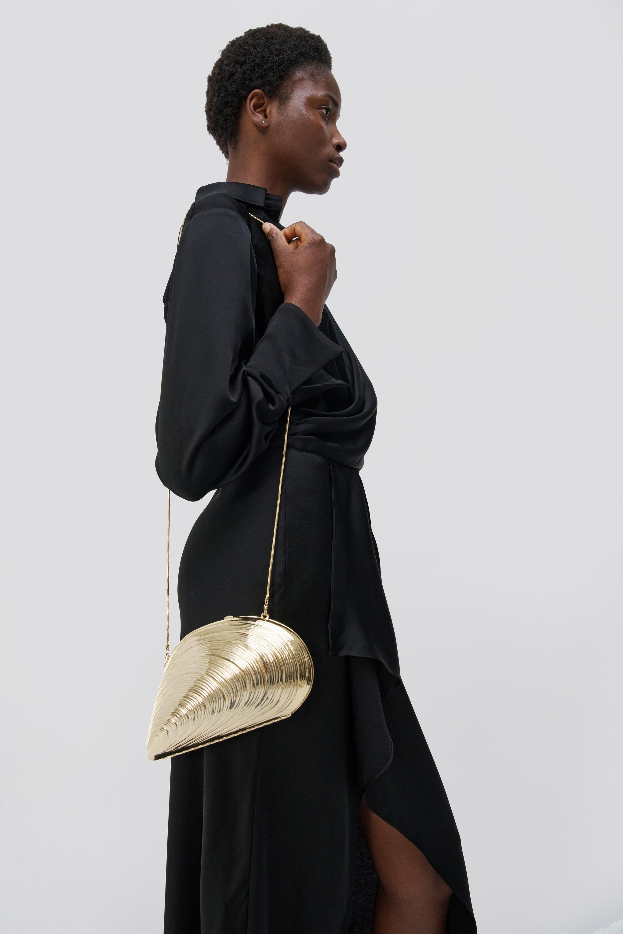 The Jonathan Simkhai Bridget Metal Oyster Shell Clutch in Gold available at The New Trend Australia