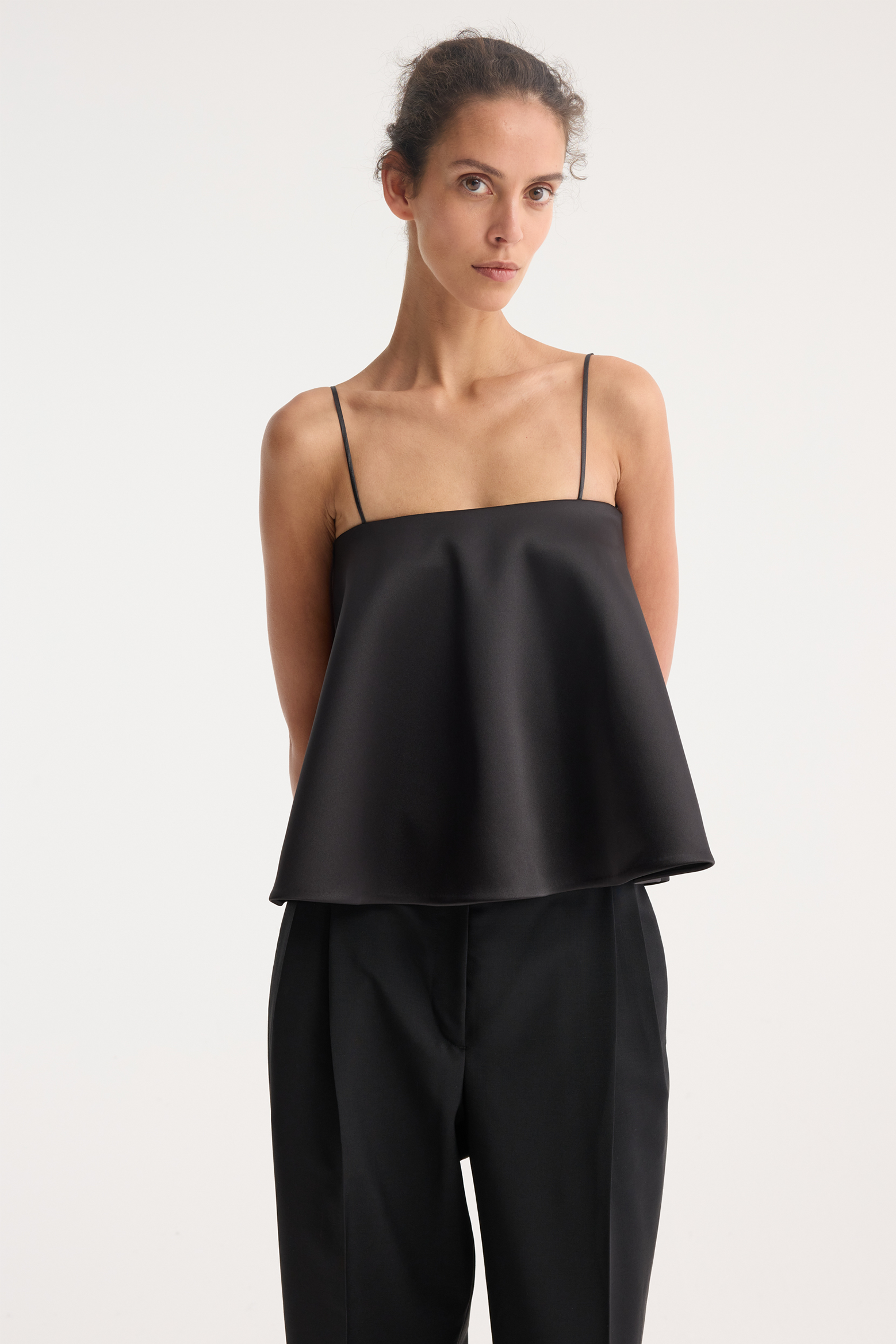 RÓHE PEPLUM SATIN TOP IN BLACK | THE NEW TREND