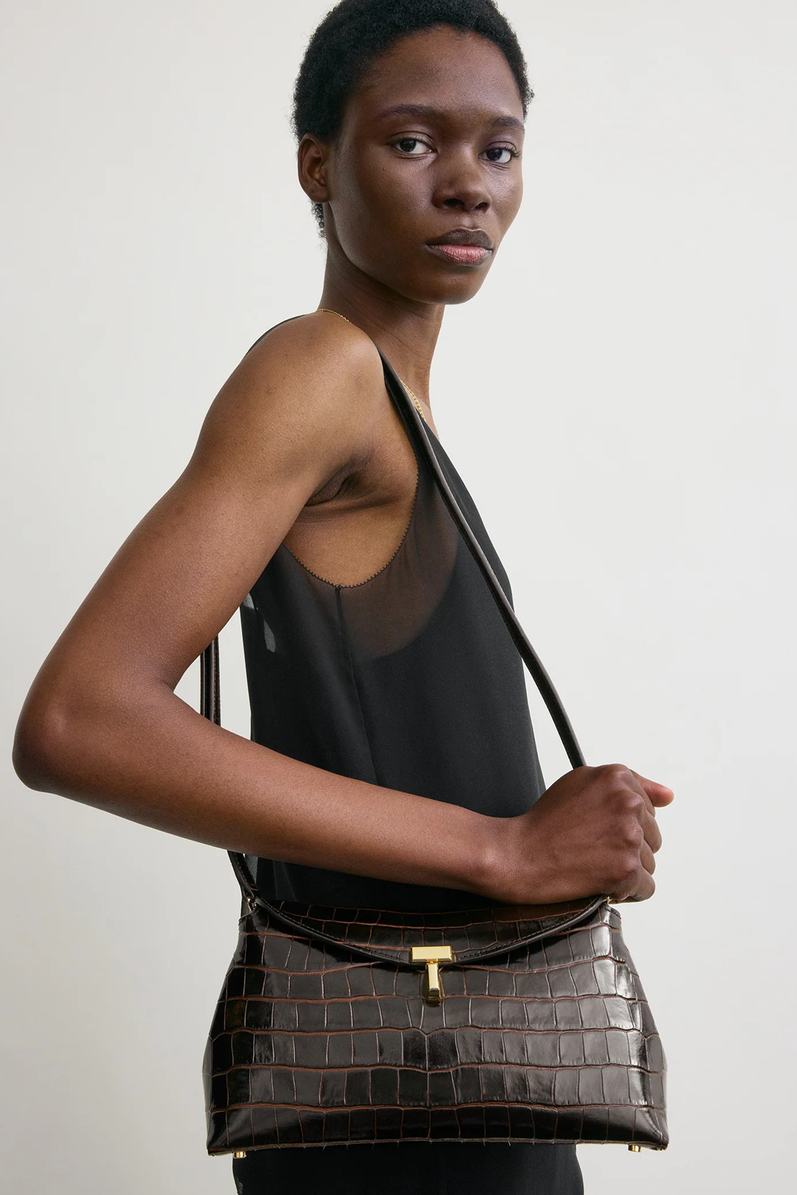 TOTEME T-LOCK CROCO-EMBOSSED CLUTCH | THE NEW TREND