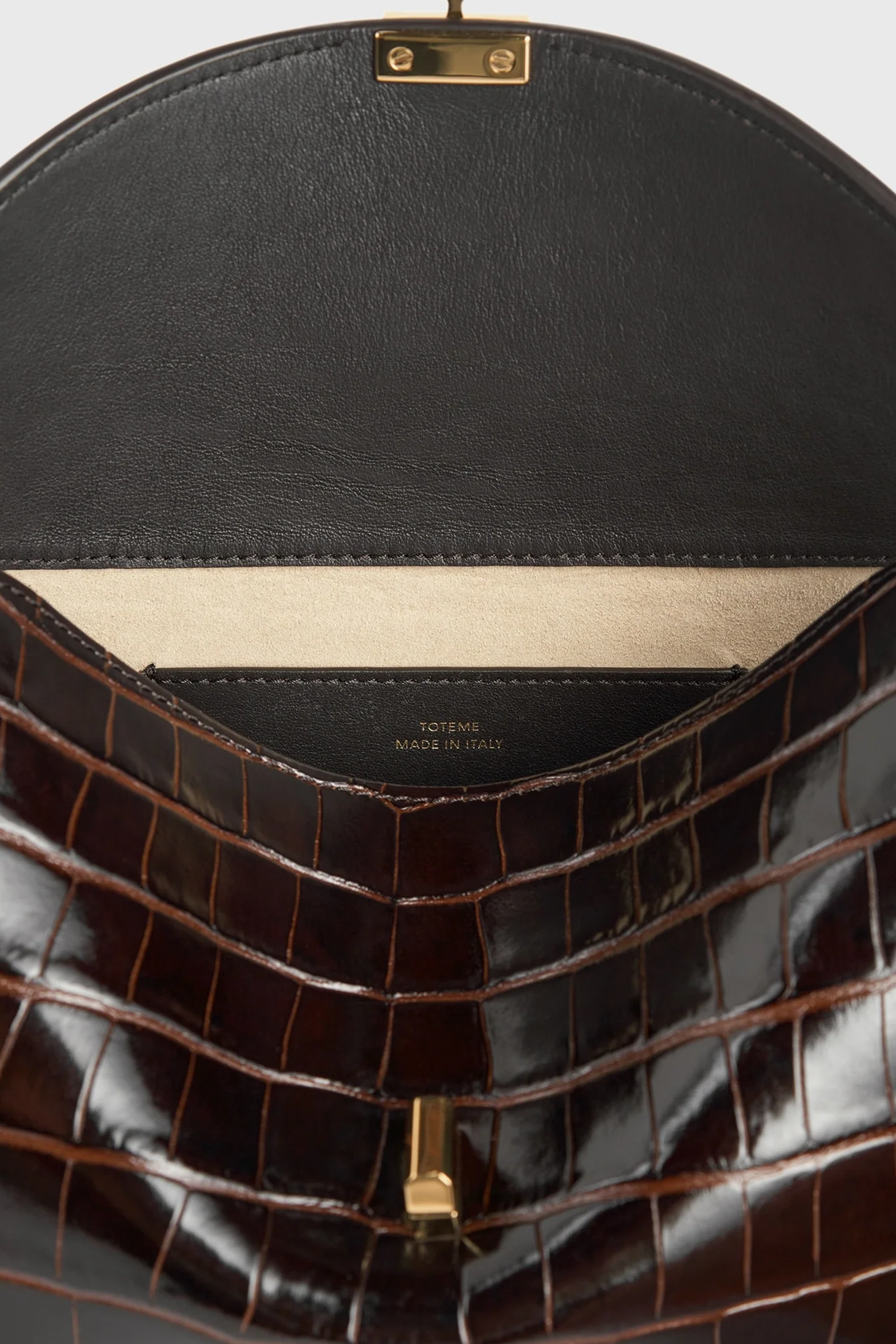 TOTEME T-LOCK CROCO-EMBOSSED CLUTCH | THE NEW TREND