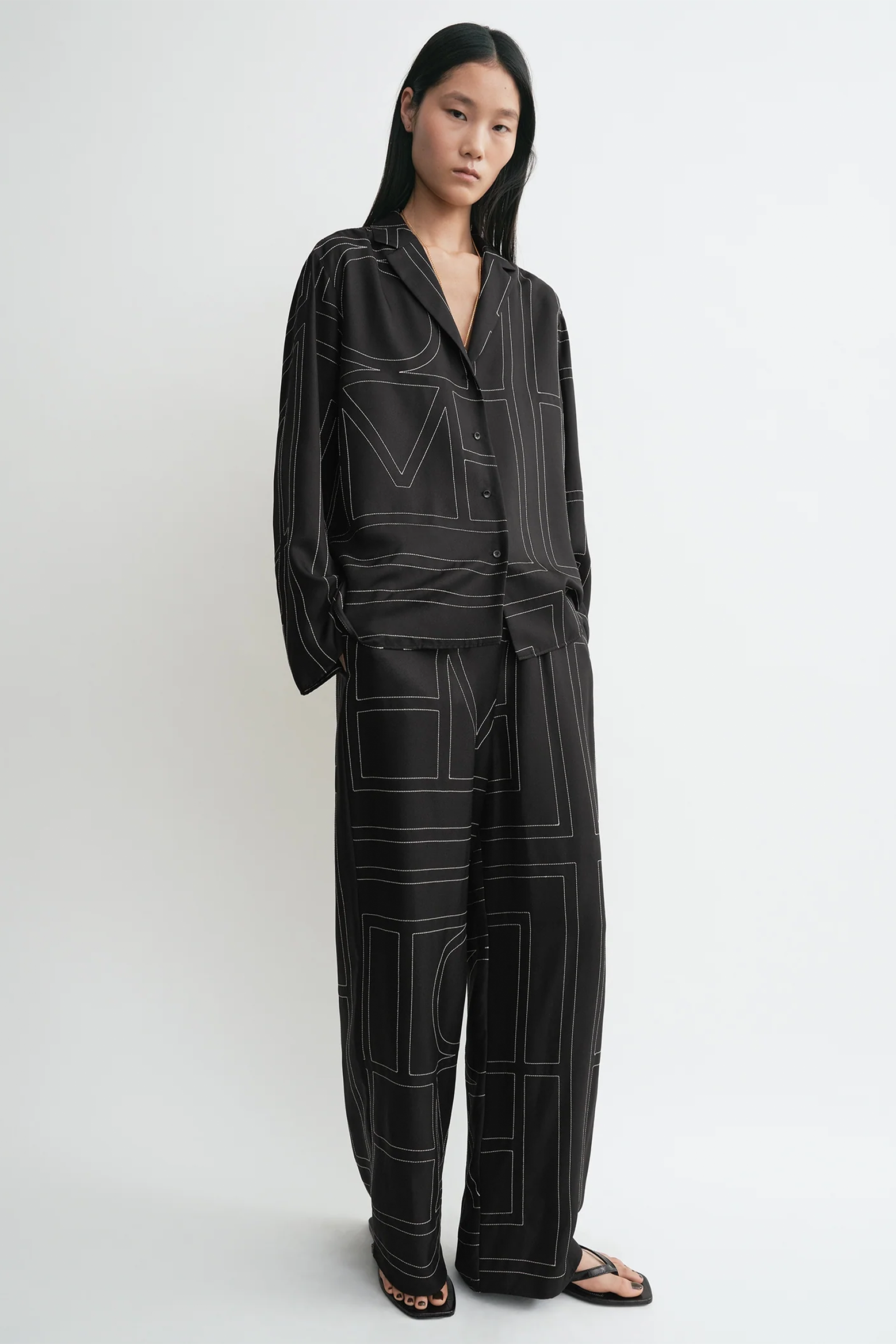 TOTEME MONOGRAM SILK PJ TOP IN BLACK | THE NEW TREND