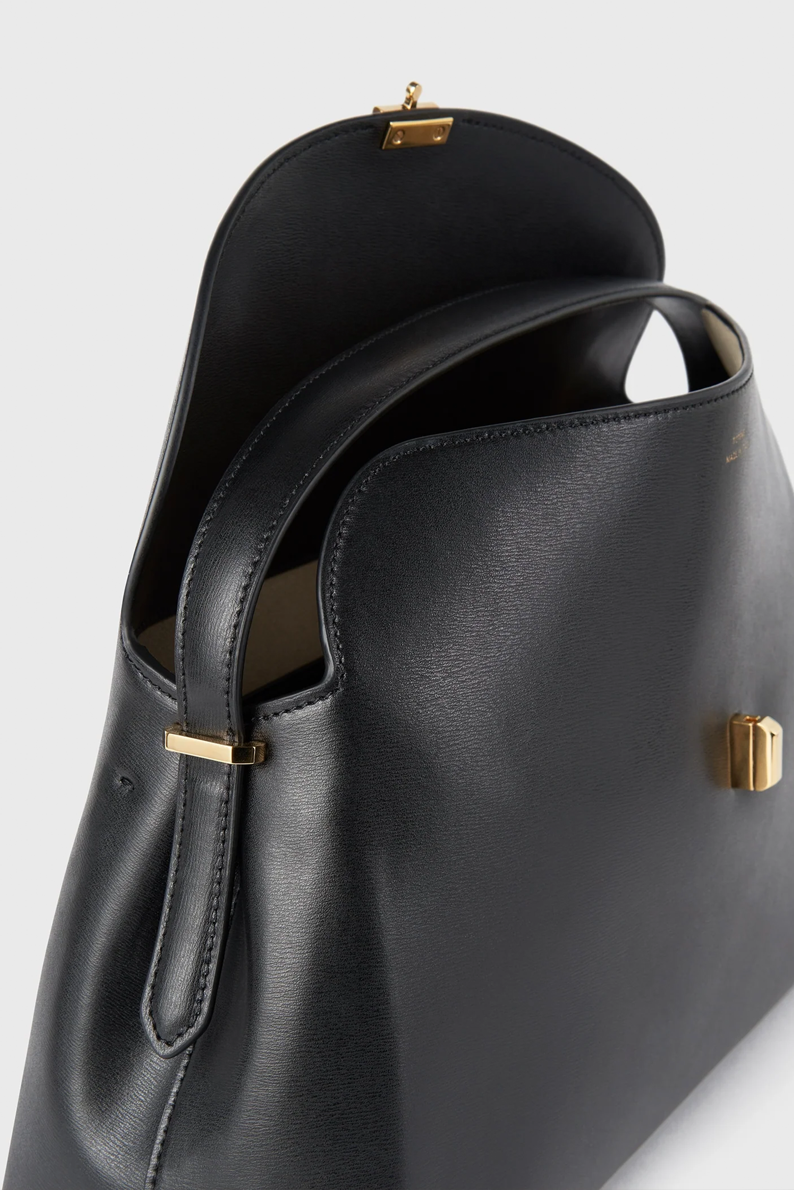 TOTEME T-LOCK LEATHER TOP HANDLE IN BLACK | THE NEW TREND