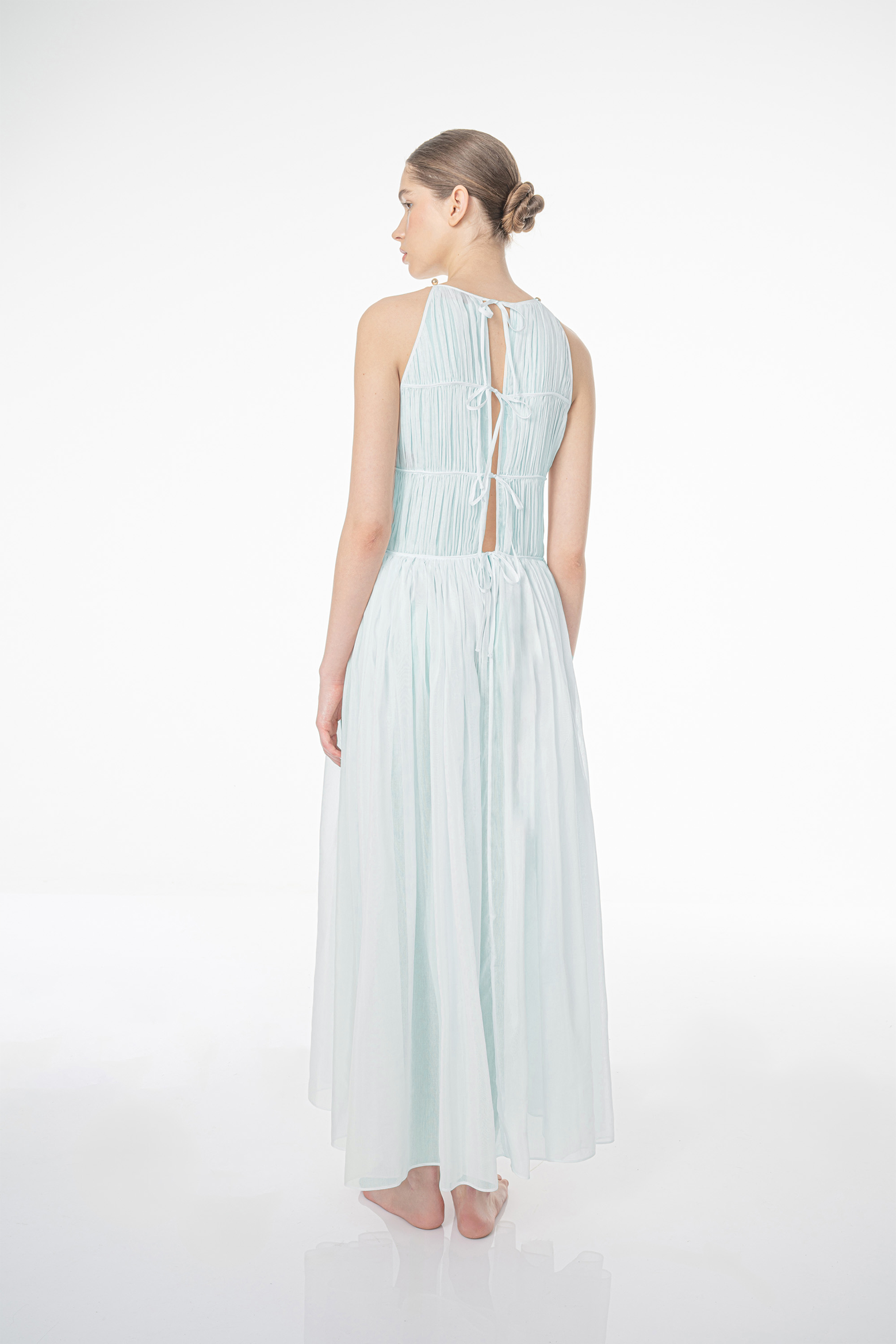 The Morgan Dress by More Noir in Pearl Blue is available at The New Trend